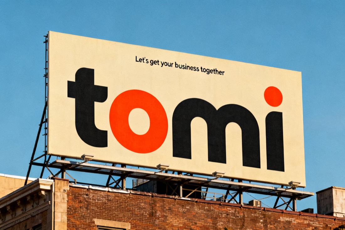 Tomi billboard on a city rooftop: giant lowercase tomi wordmark with an orange o on cream, tagline Let's get your business together